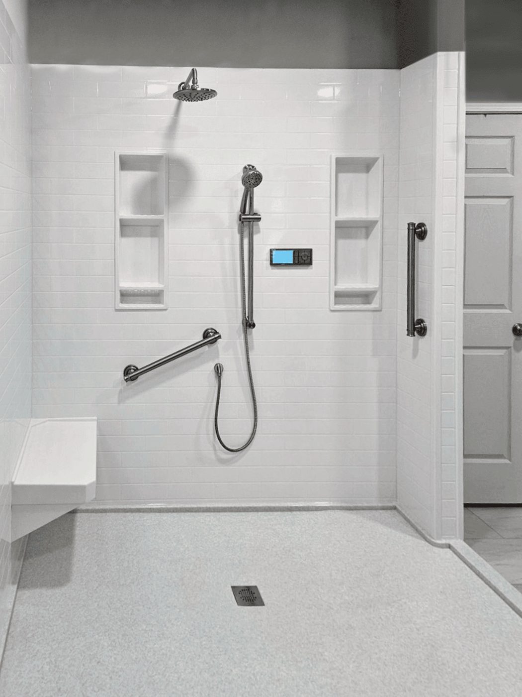 Easy-access shower with grab bars and bench