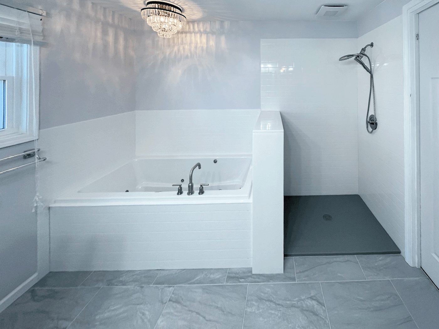 Spacious remodeled bathroom with a soaking tub and walk-in shower